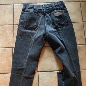 Mens wrangler with torn knee